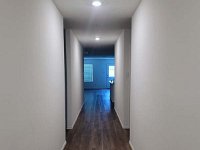 20230713 135458  From the front door - 2 bedrooms and bath on the left, 1 bedroom and laundry room on the right.